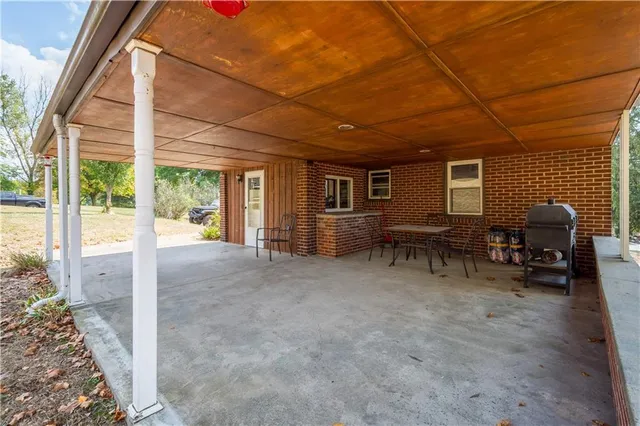 a view of a livingroom with furniture and a yard
