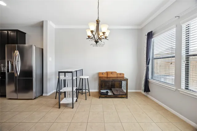 a kitchen with stainless steel appliances granite countertop a stove a refrigerator and a refrigerator