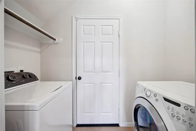 a bedroom with a bed and a television