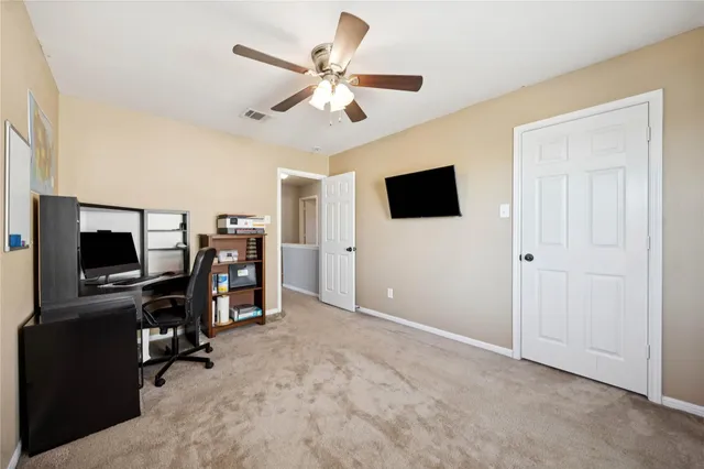 a spacious bedroom with a bed and window