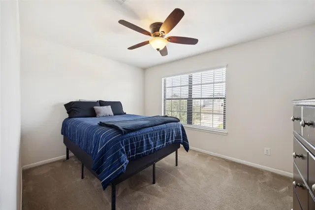 a bathroom with a sink vanity mirror and toilet