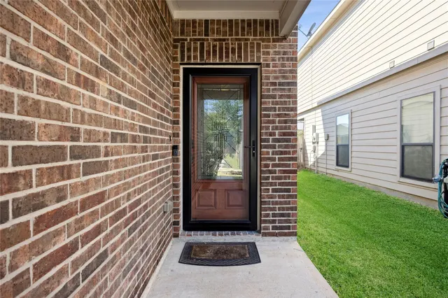a view of a door and a window