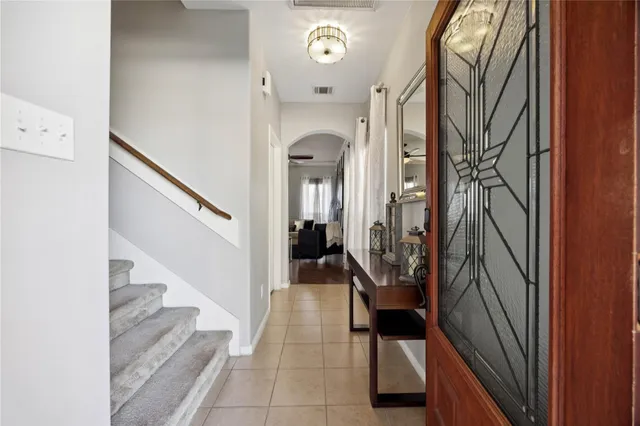 a view of a hallway with wooden floor and entryway