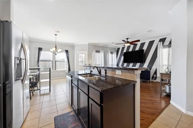a view of a livingroom with furniture and a window