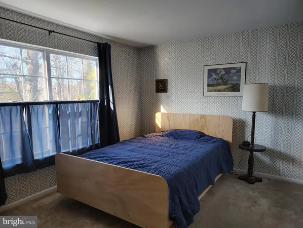 wooden floor in a room next to a window