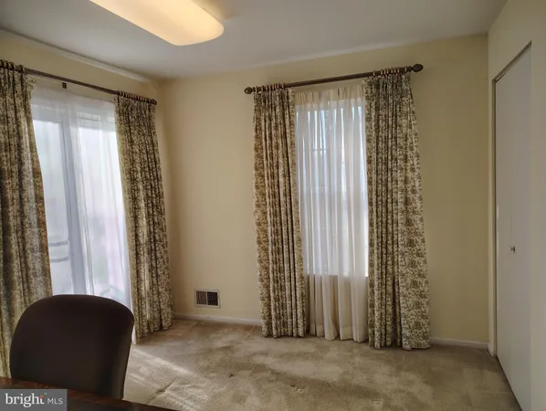 a view of a workspace with furniture