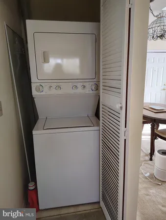a bathroom with a sink a toilet a mirror and shower curtain