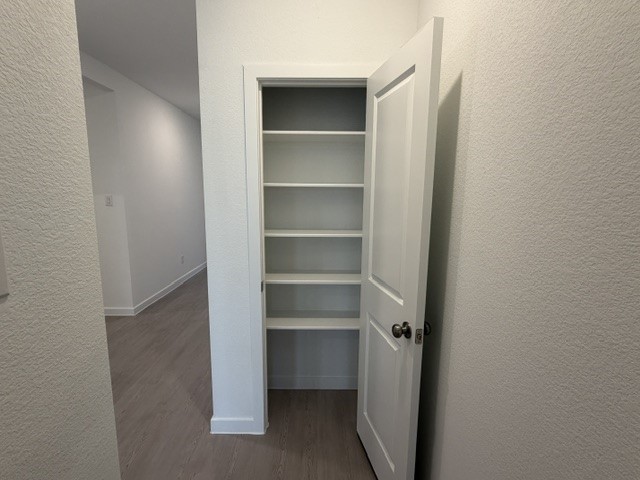 2514 Rose Gold Drive Rosharon, TX 77583 - Photo 16 of 27 a view of walk in closet with empty racks