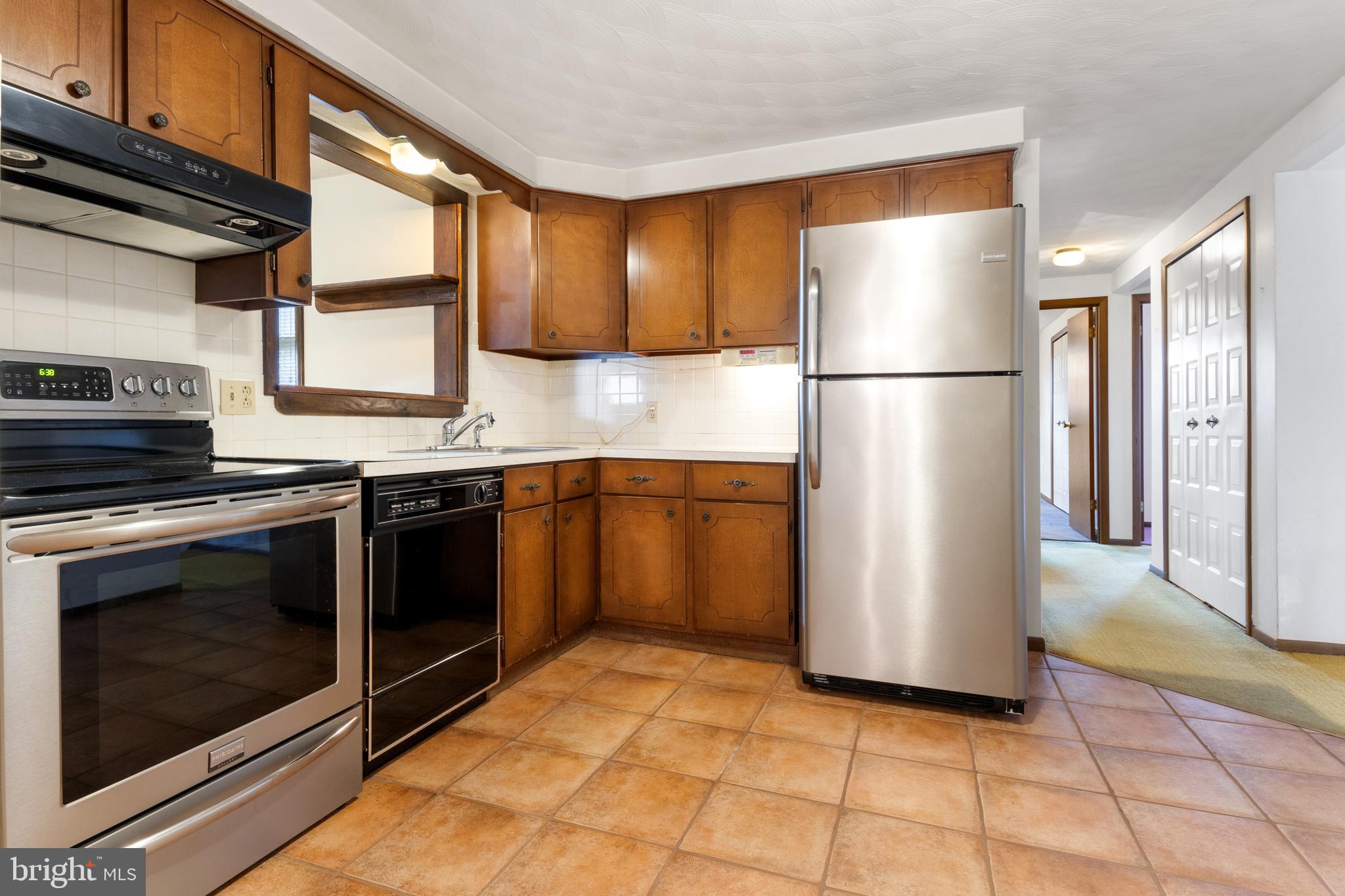 2266 Sycamore Road York, PA 17408 - Photo 13 of 43 a kitchen with a refrigerator sink and stove