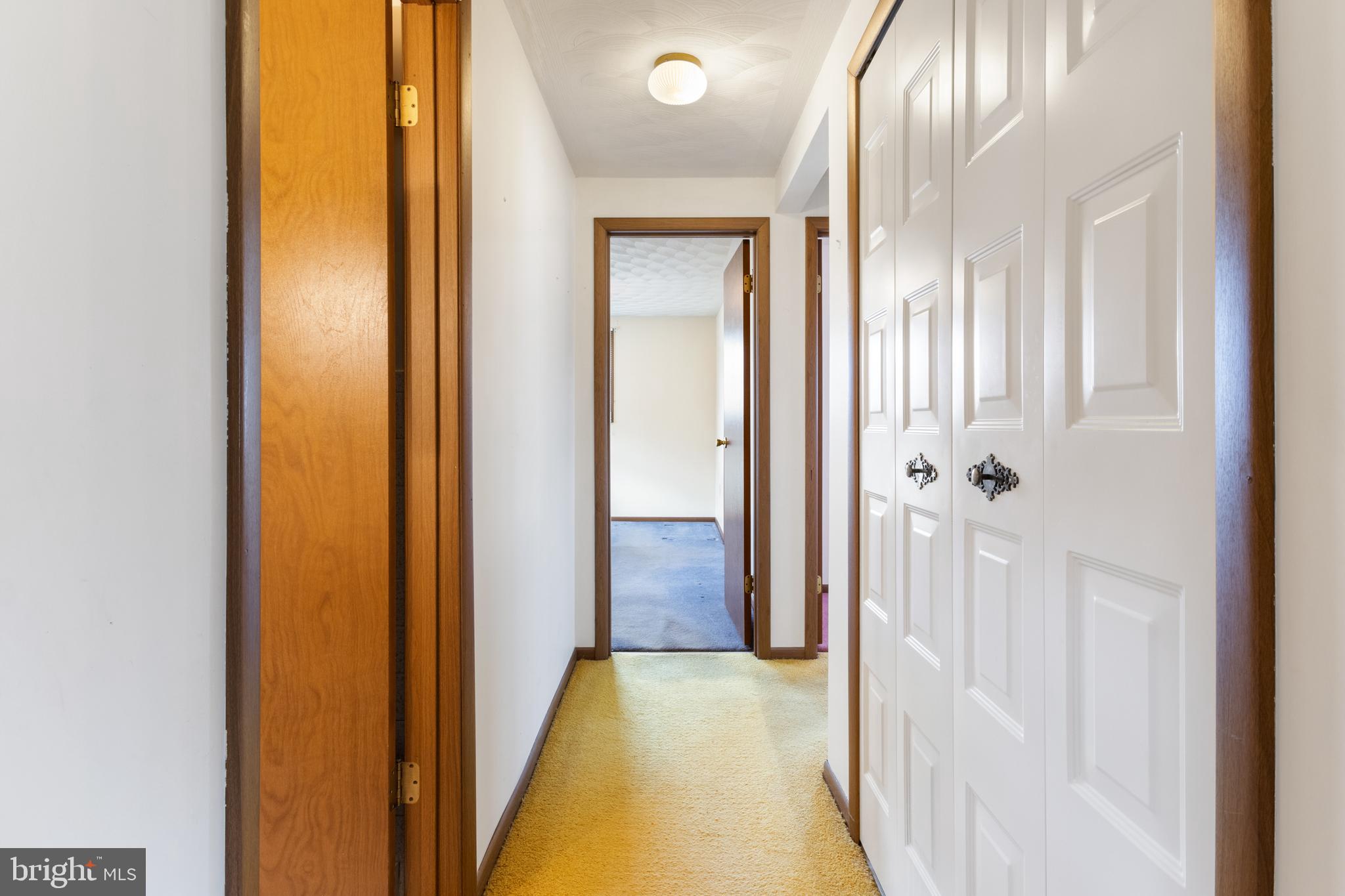 2266 Sycamore Road York, PA 17408 - Photo 16 of 43 a view of a hallway with wooden floor and a bathroom