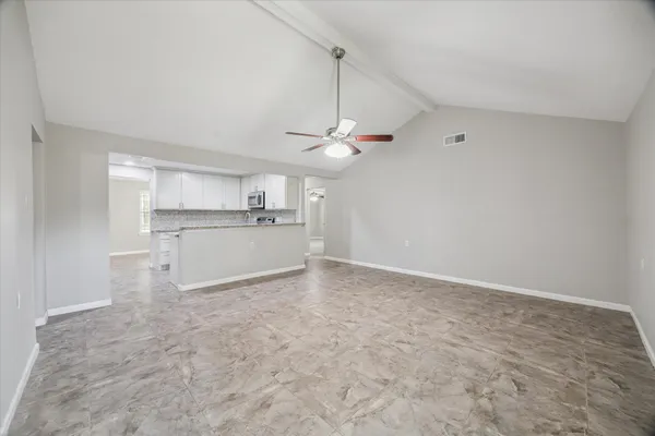 a view of an empty room with a window