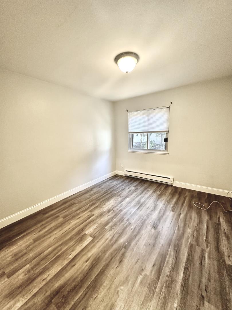 401 Piccadilly Place, Unit 9 San Bruno, CA 94066 - Photo 4 of 8 an empty room with a window