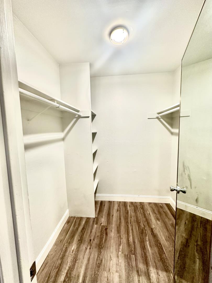 401 Piccadilly Place, Unit 9 San Bruno, CA 94066 - Photo 5 of 8 a view of a room with wooden floor and white walls