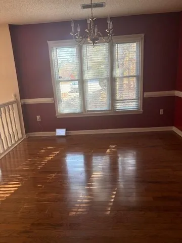 a kitchen with a sink window and cabinets