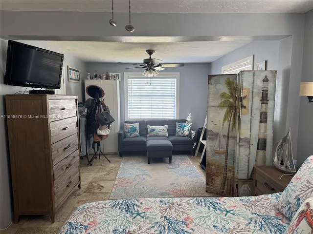 a bathroom with a toilet sink and shower