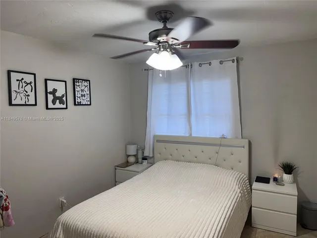 a kitchen with stainless steel appliances granite countertop a refrigerator sink and stove