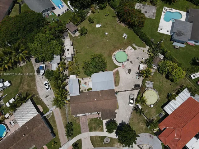 an aerial view of a house with swimming pool