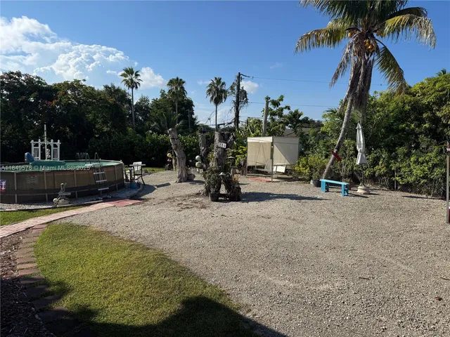a view of a park with swings and slides