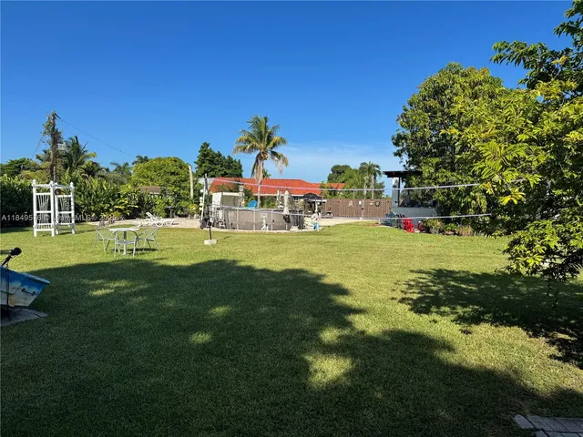 a view of a park with large trees