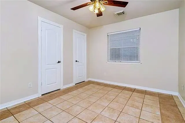 a view of an empty room and window