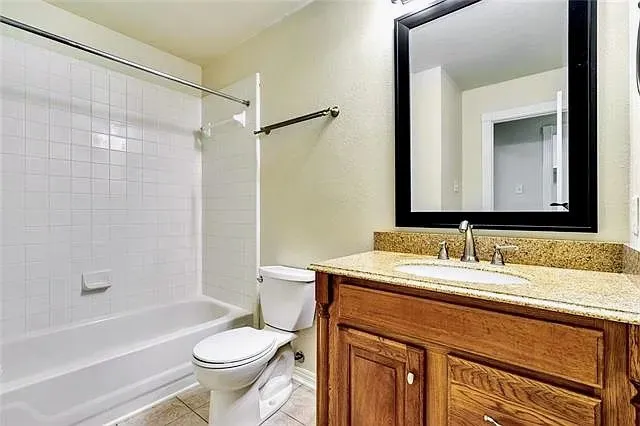 a bathroom with a sink a toilet and a bathtub