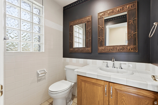 3535 Homestead Road Park City, UT 84098 - Photo 21 of 81 Bathroom featuring a wood-finish vanity with an integrated sink and a tile countertop