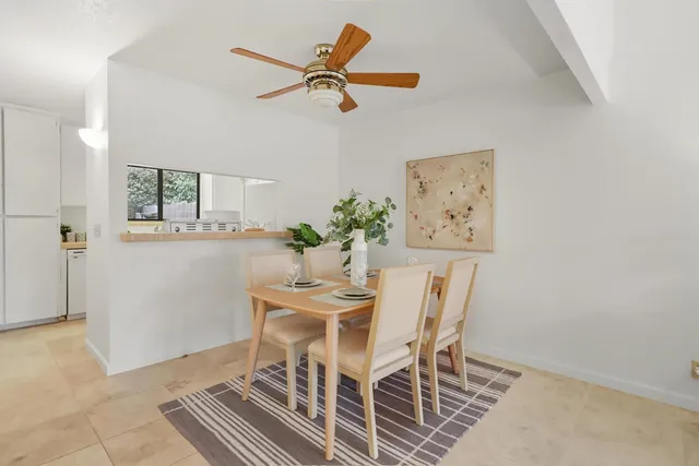 a utility room with cabinets washer and dryer