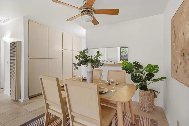 a kitchen with stainless steel appliances a sink a stove a refrigerator and cabinets