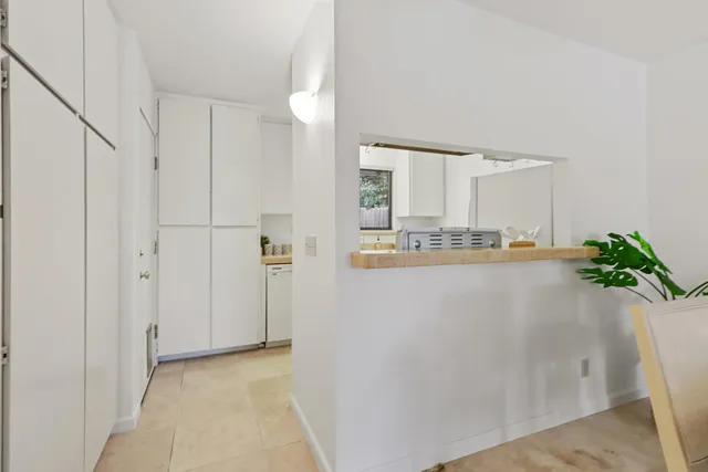 a kitchen with a stove and a refrigerator