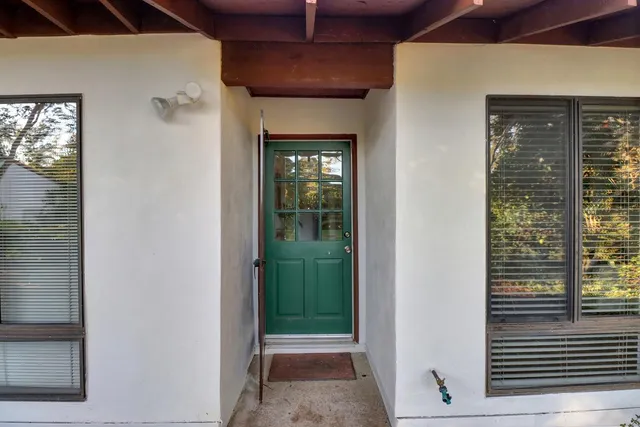 a view of a hallway with windows