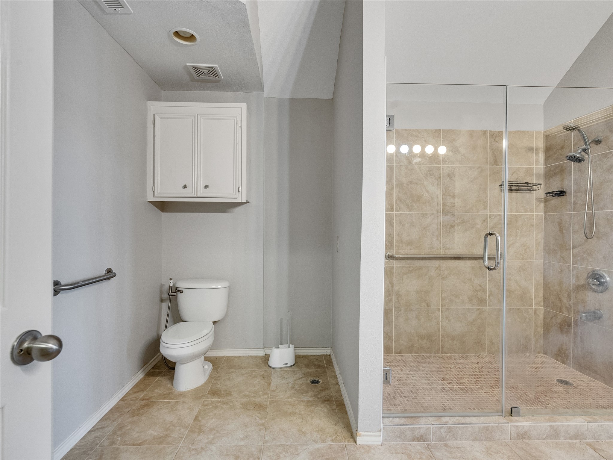 5643 Walnut Glen Lane Rosenberg, TX 77471 - Photo 15 of 42 a bathroom with a toilet and a shower
