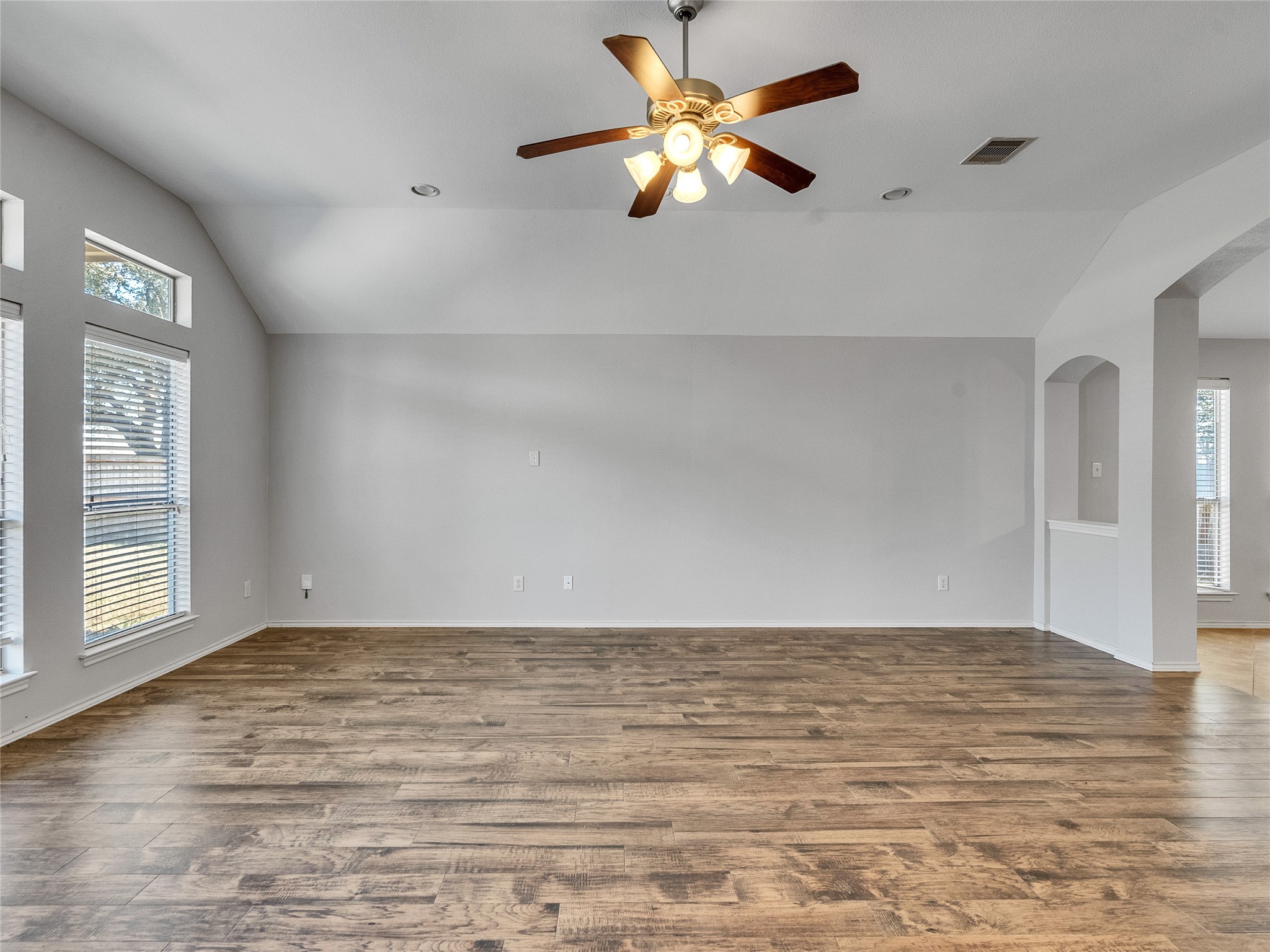 5643 Walnut Glen Lane Rosenberg, TX 77471 - Photo 19 of 42 a view of an empty room with window and chandelier fan