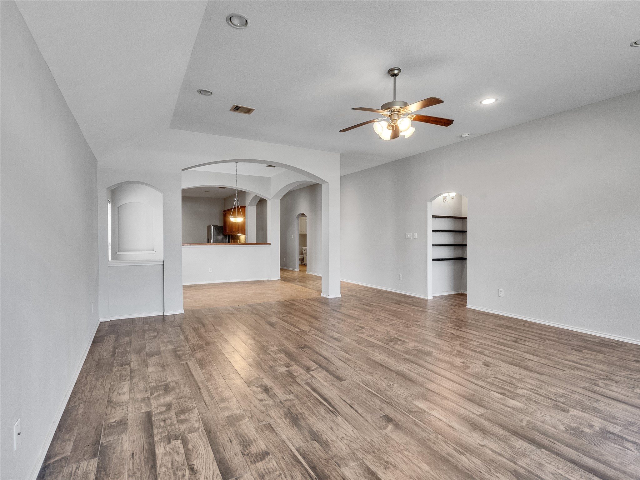 5643 Walnut Glen Lane Rosenberg, TX 77471 - Photo 20 of 42 a view of empty room with wooden floor and fan