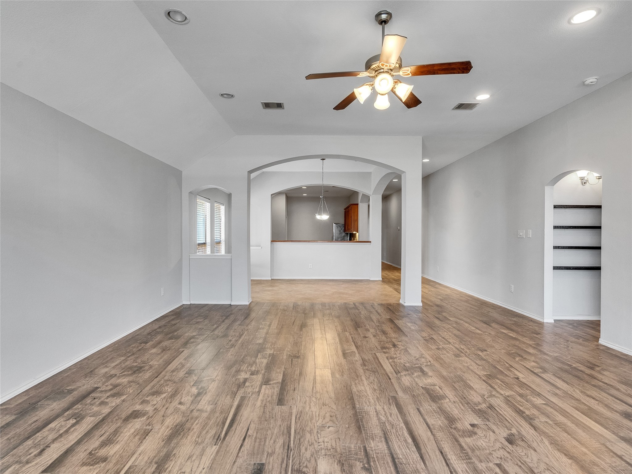 5643 Walnut Glen Lane Rosenberg, TX 77471 - Photo 21 of 42 a view of empty room with wooden floor and fan