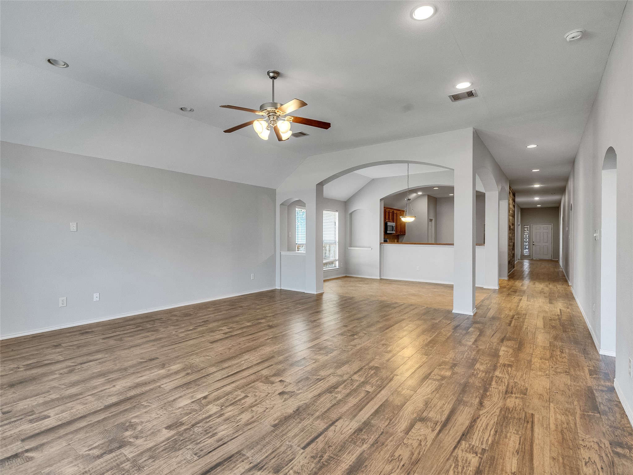 5643 Walnut Glen Lane Rosenberg, TX 77471 - Photo 22 of 42 a view of empty room with wooden floor and window