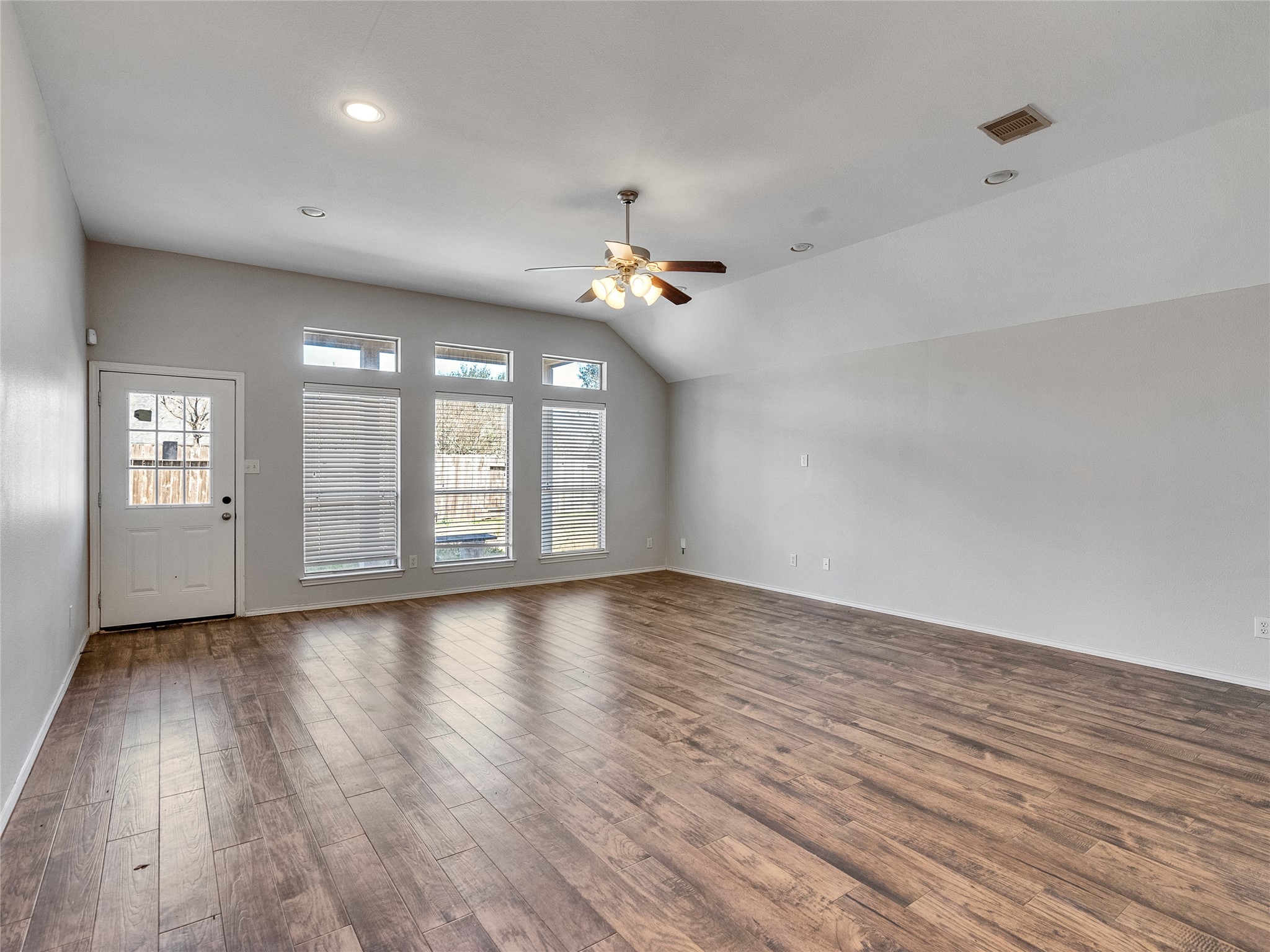 5643 Walnut Glen Lane Rosenberg, TX 77471 - Photo 23 of 42 a view of an empty room with window and wooden floor