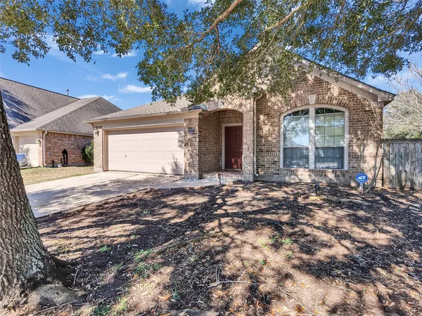 a view of a house with a tree