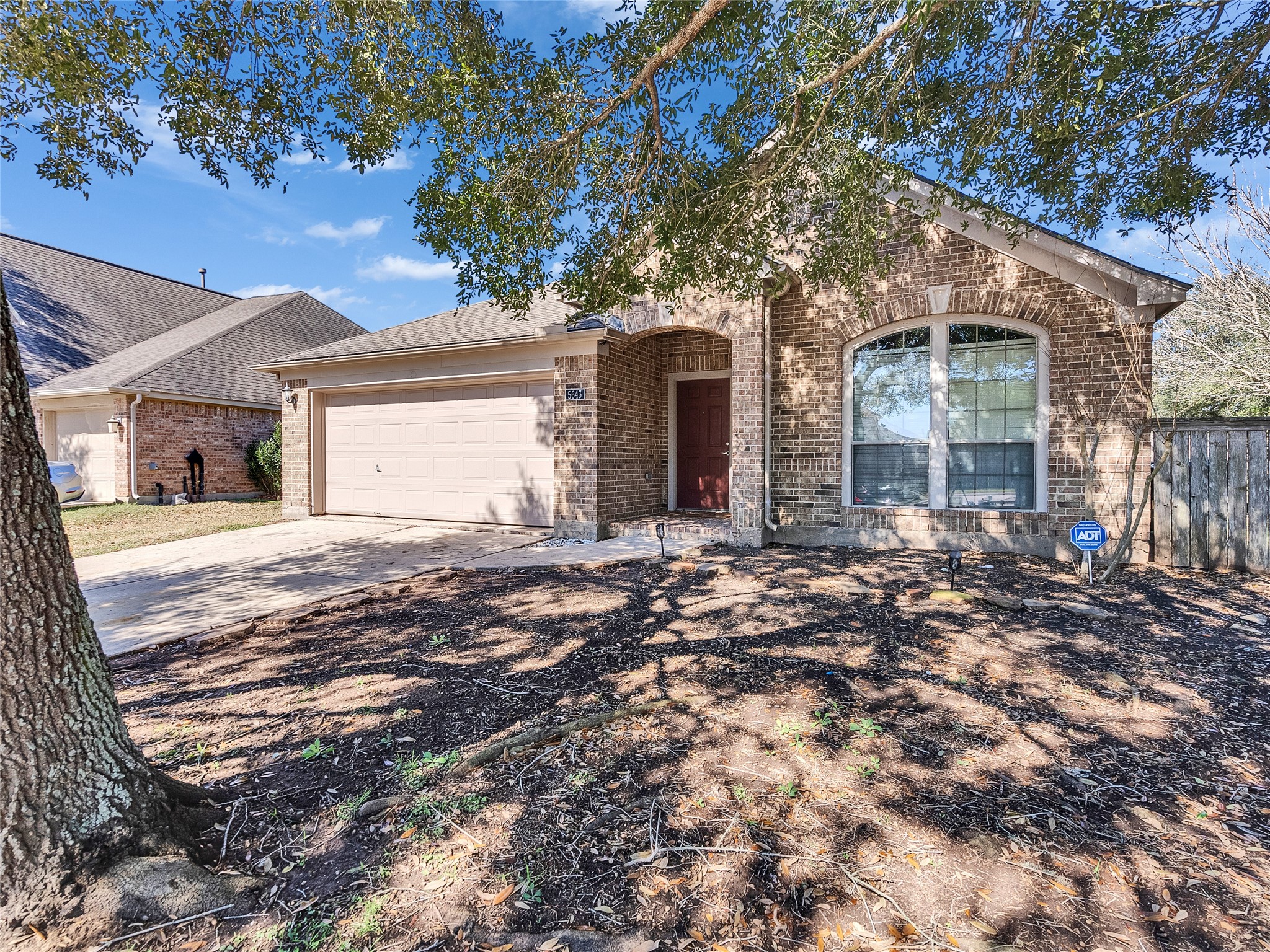 5643 Walnut Glen Lane Rosenberg, TX 77471 - Photo 3 of 42 a view of a house with a tree