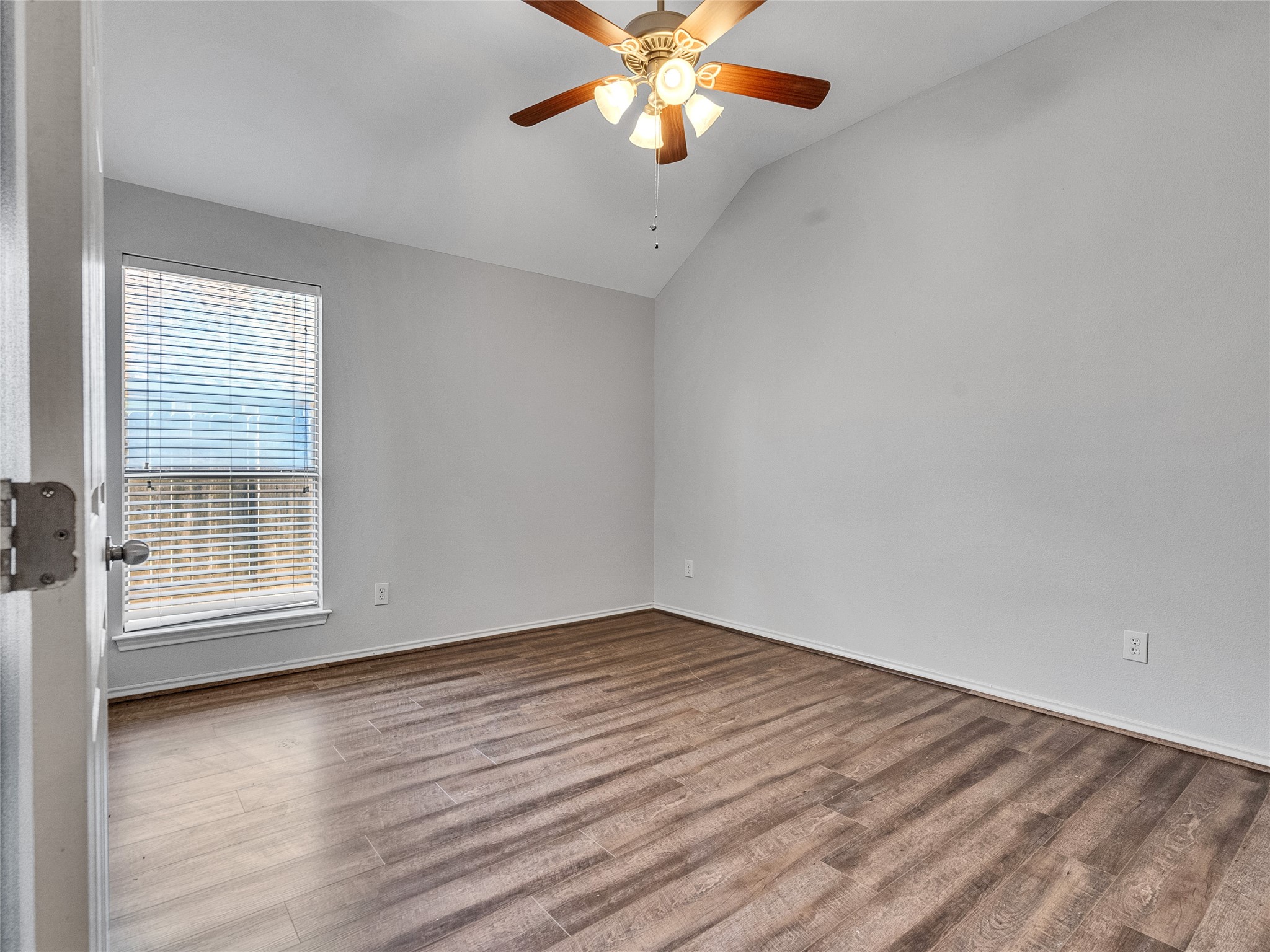 5643 Walnut Glen Lane Rosenberg, TX 77471 - Photo 34 of 42 wooden floor in an empty room with a window
