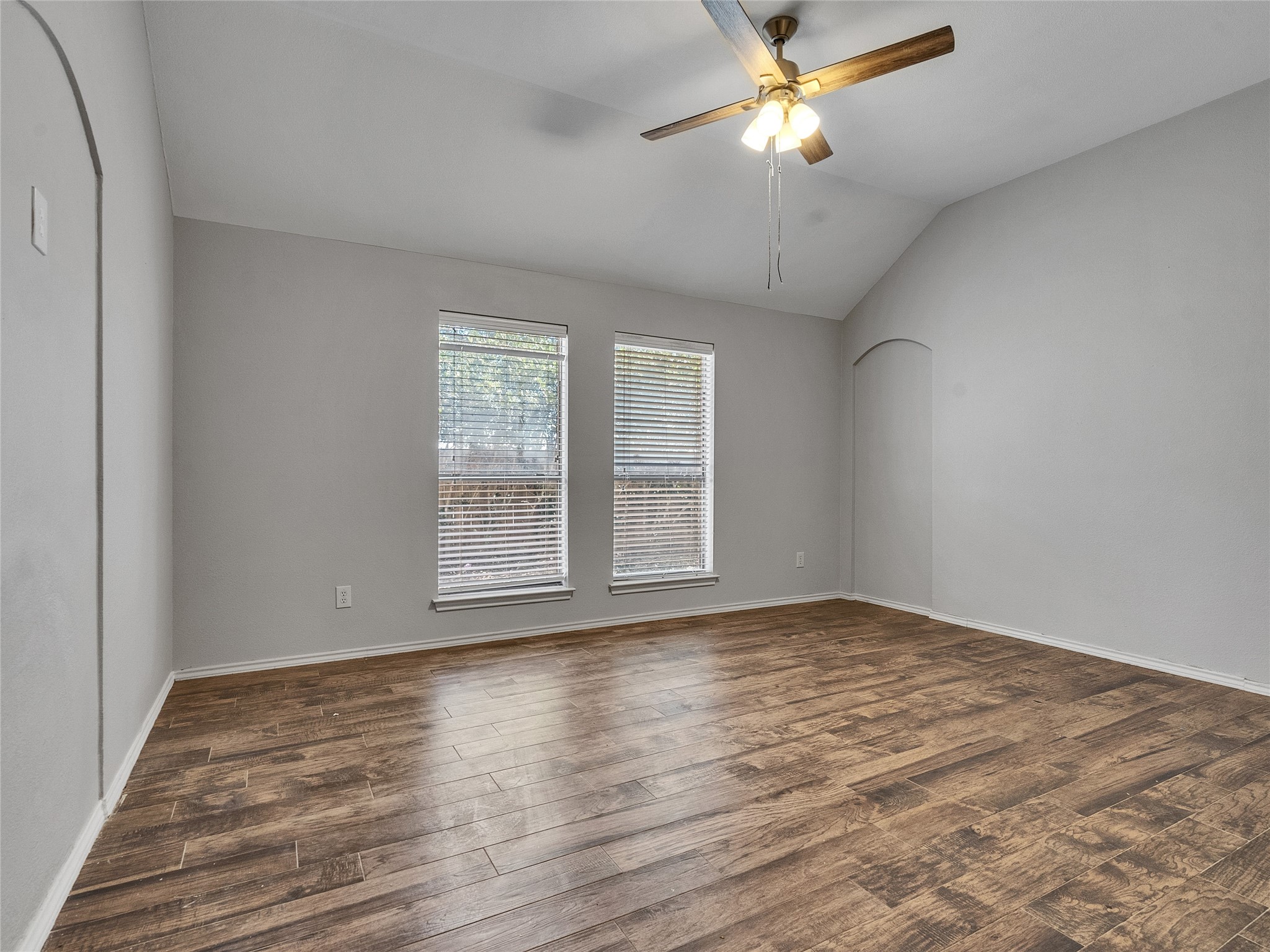 5643 Walnut Glen Lane Rosenberg, TX 77471 - Photo 39 of 42 a view of empty room with wooden floor and fan