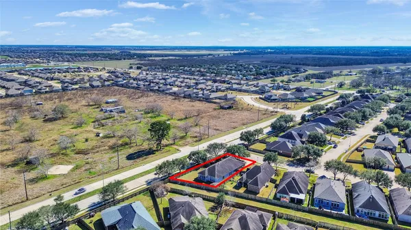 a view of a house with a flower garden