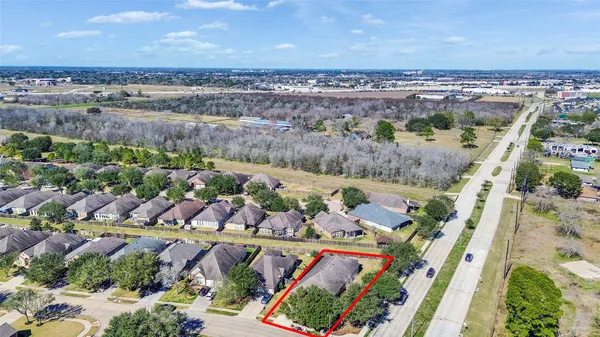an aerial view of a house with outdoor space