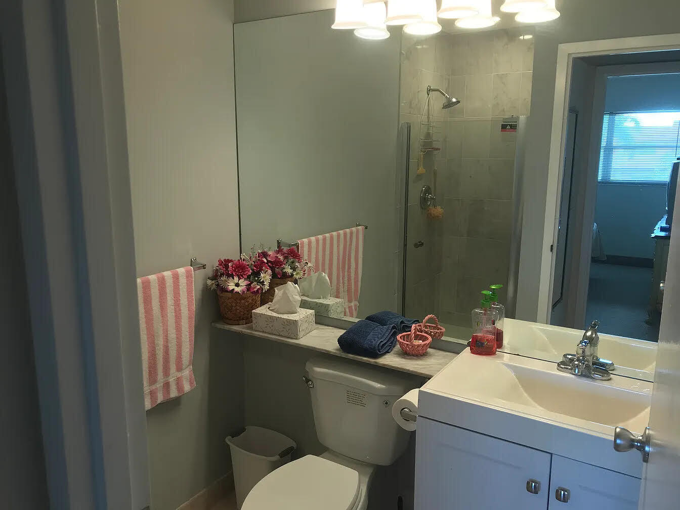 596 Saxony M, Unit 596 Delray Beach, FL 33446 - Photo 6 of 23 a bathroom with a sink toilet and shower