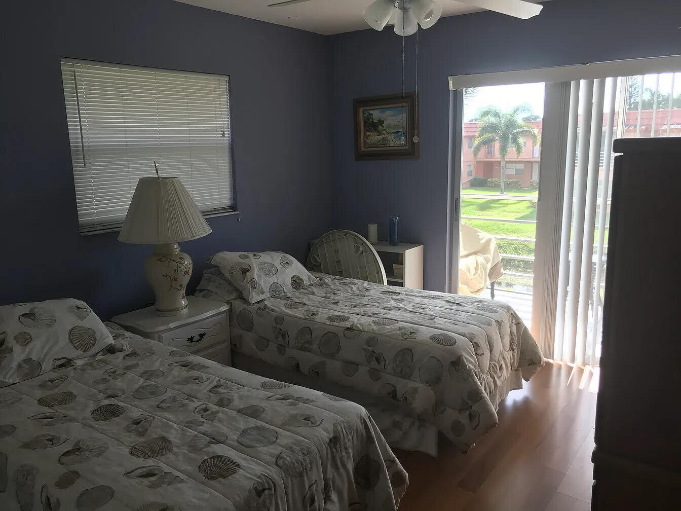 596 Saxony M, Unit 596 Delray Beach, FL 33446 - Photo 8 of 23 a bedroom with two beds and a window