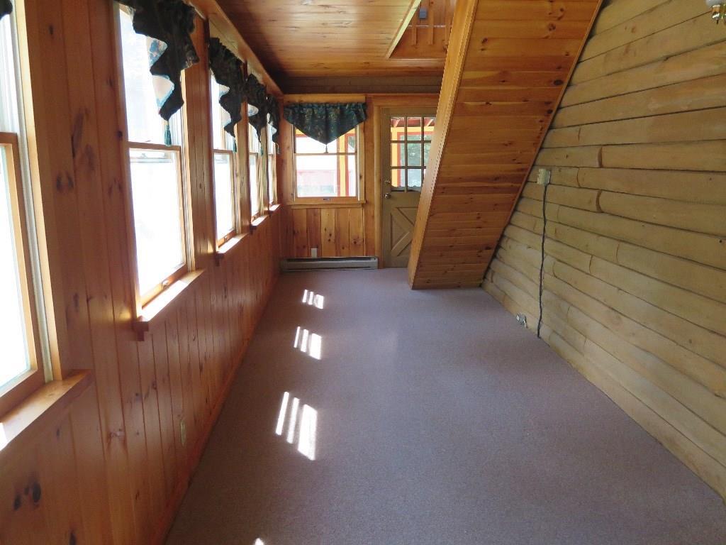 69 Pemaquid Harbor Road Pemaquid, ME 04558 - Photo 8 of 12 Enclosed porch showing stairway to...