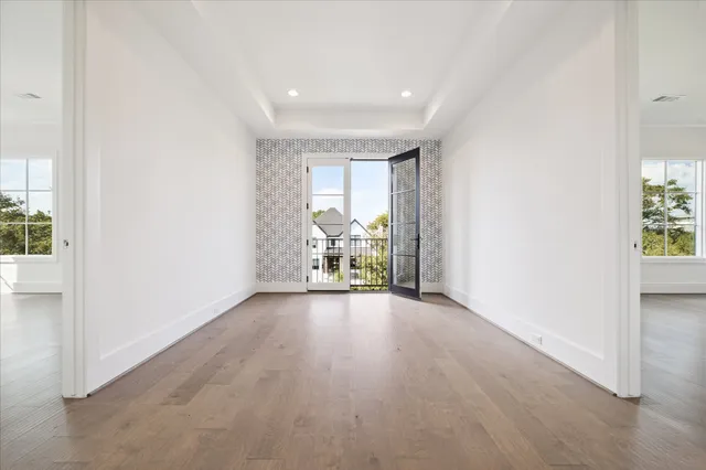 an empty room with a empty space and windows