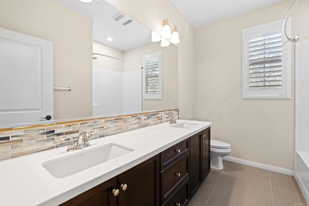 15968 Parkview Loop San Diego, CA 92127 - Photo 20 of 45 a bathroom with a sink double vanity and a toilet