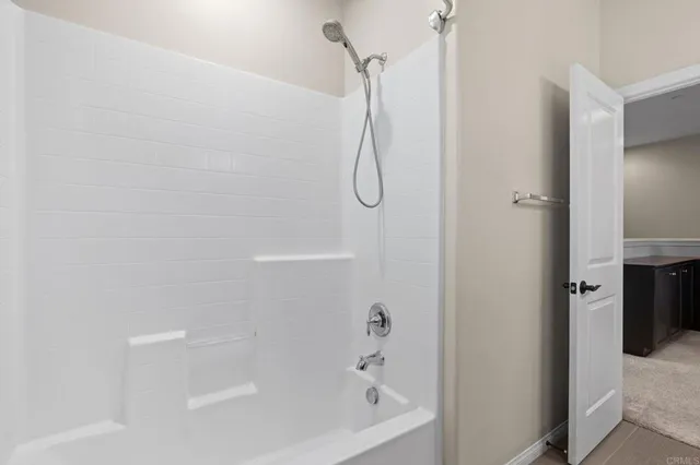 a bathroom with a bath tub and a shower