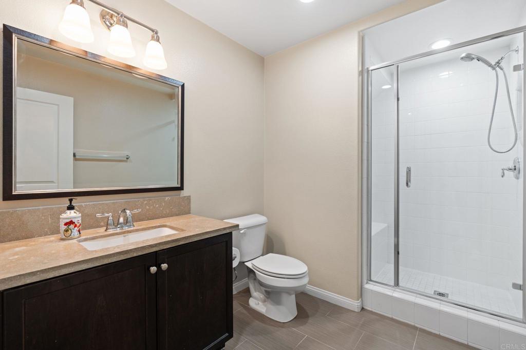15968 Parkview Loop San Diego, CA 92127 - Photo 24 of 45 a bathroom with a granite countertop sink toilet and shower