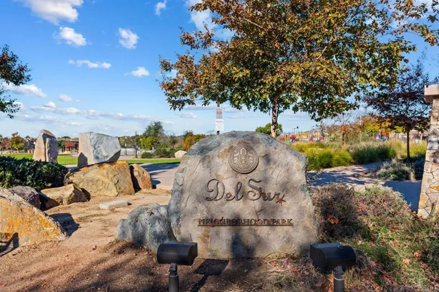 a view of a fire pit with large tree